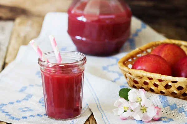 Plum juice in a glass — Stock Photo, Image