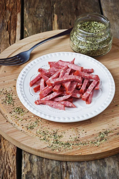 Sliced salami and spices — Stock Photo, Image