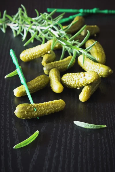 Pickles and a sprig of rosemary — Stock Photo, Image