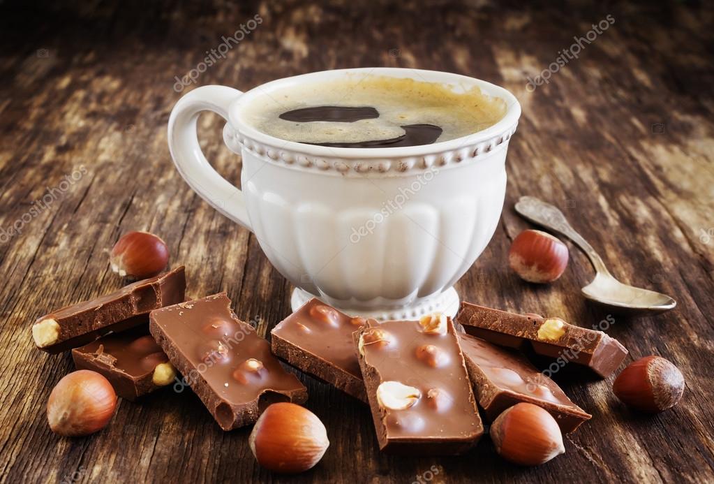 https://st2.depositphotos.com/2487247/9452/i/950/depositphotos_94522652-stock-photo-cup-of-coffee-and-chocolate.jpg