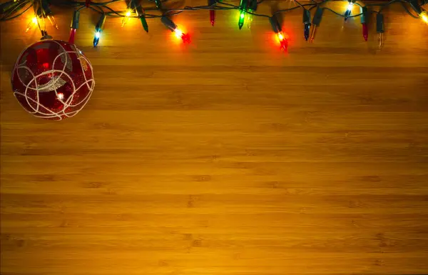 Christmas background with electrovalency on a wooden surface with space for text. — Stock Photo, Image