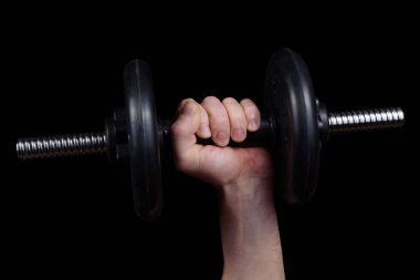 Kanserde siyah arka planda büyük bir dambıl.