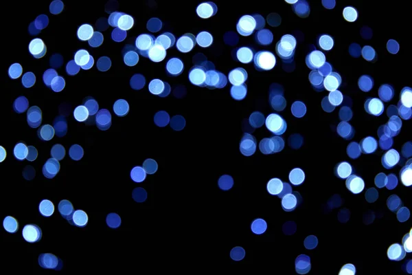Defokussiert Bokeh Weihnachten Kalte Blaue Kleine Lichter Auf Schwarzem Hintergrund — Stockfoto