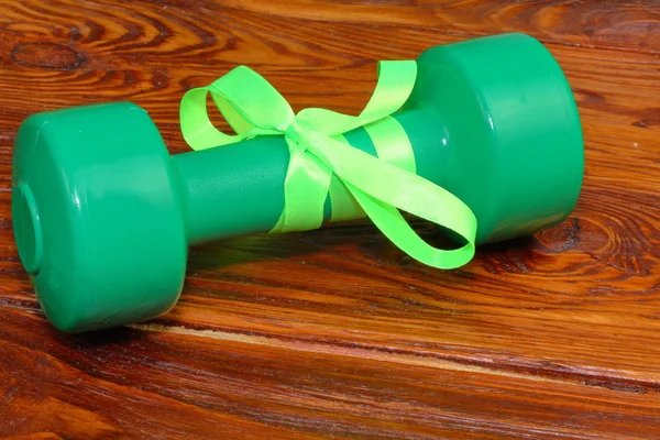 Gift in the form of a dumbbell for fitness — Stock Photo, Image