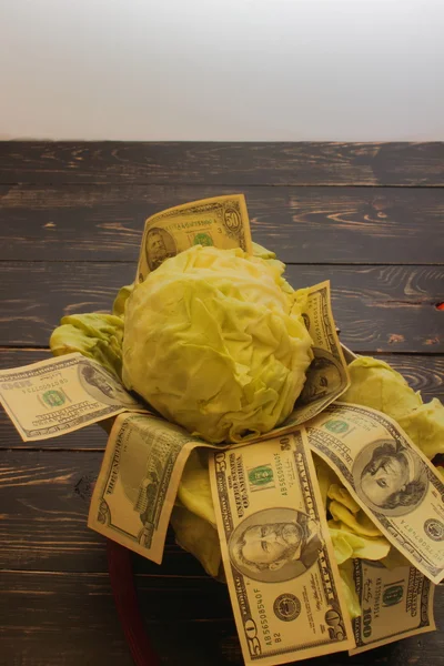 Cabbage with dollars — Stock Photo, Image