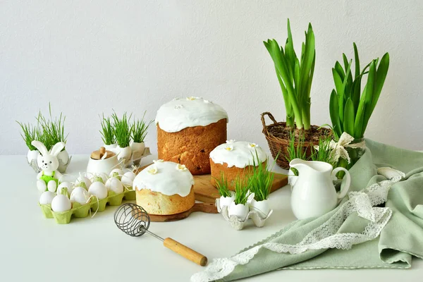 Easter sweet bread, Easter cake with green grass. Holidays breakfast concept with copy space. Easter greeting card template. Homemade pasques.Easter sweets on white background.