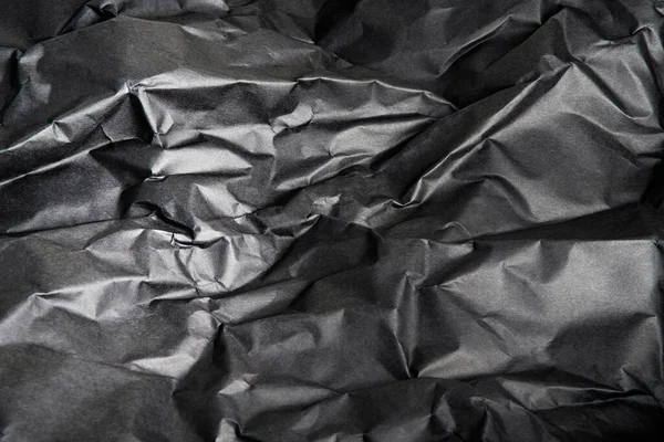 Arkaplan Resmi Olarak Buruşmuş Siyah Kağıdın Desenli Gölgeli Bir Arazisi — Stok fotoğraf