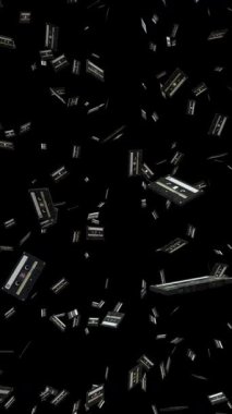 Dikey düşen Siyah retro ses kasetlerinin döngü animasyonu