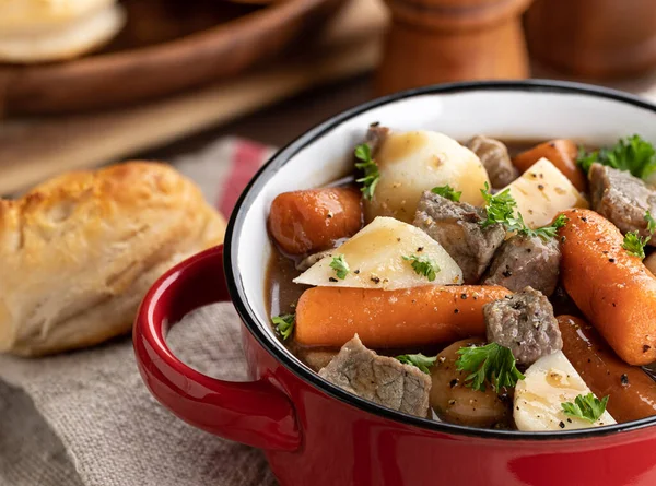 Beef Stew Carrots Potatoes Red Bowl Biscuits Background Closeup View — Stock Photo, Image
