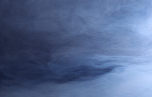 Abstract background of swirling blue smoke