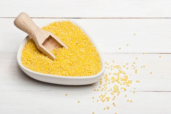 Millet groats in white bowl — Stock Photo, Image