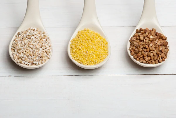 Barley, buckwheat and millet groats — Stock Photo, Image