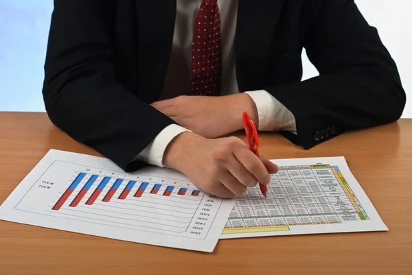 Businessman examining graphs Royalty Free Stock Images