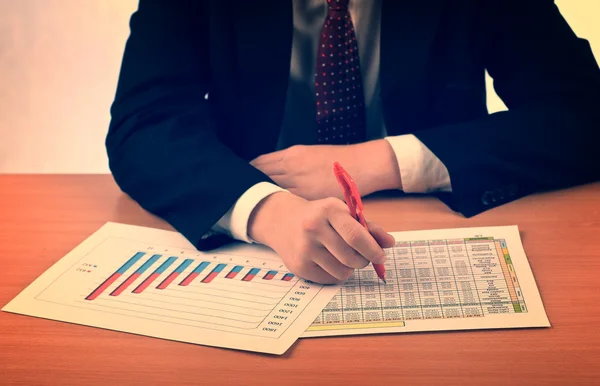 Businessman examining graphs Stock Photo