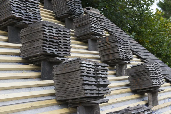 Piles of tiles on a roof — Stock Photo, Image