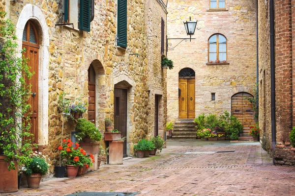 Flowery streets on a rainy spring day in a small magical village — Stock Photo, Image