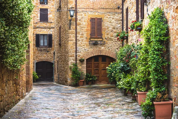 Flowery streets on a rainy spring day in a small magical village — Stock Photo, Image