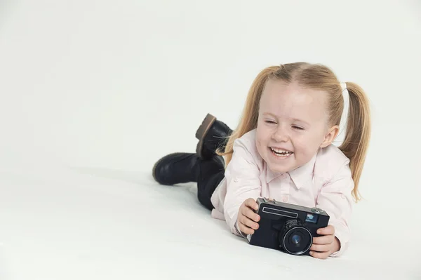 Smiling and having fun the photographer a beautiful blond girl o — Stock Photo, Image