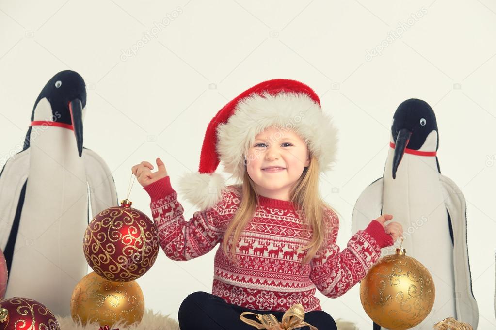 Christmas atmosphere and beautiful smiling blond little girl