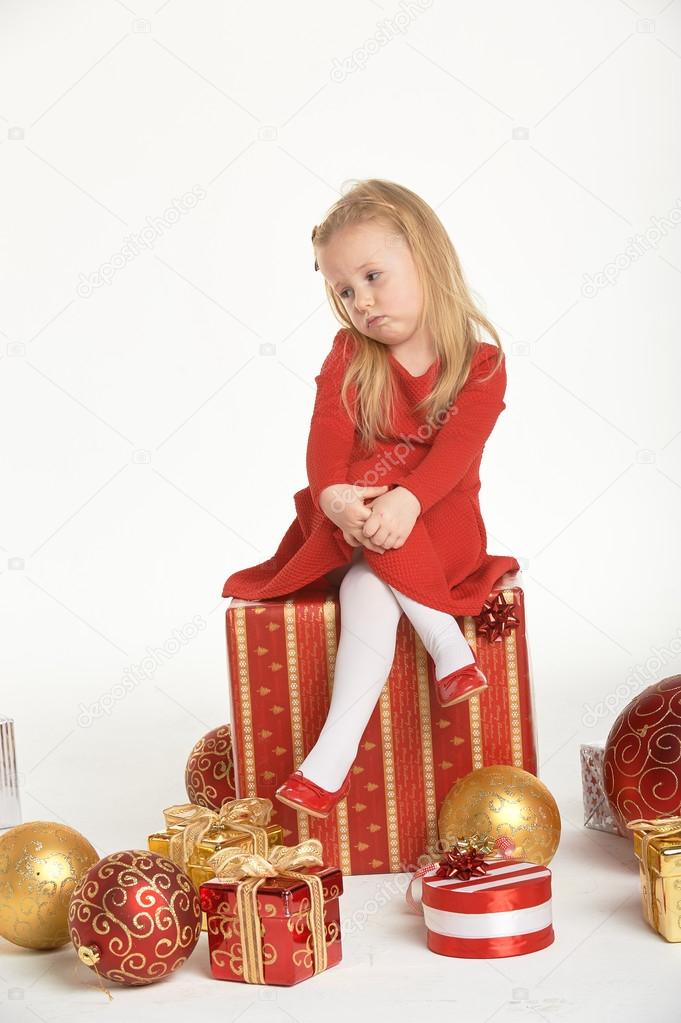 Christmas atmosphere and beautiful smiling blond little girl