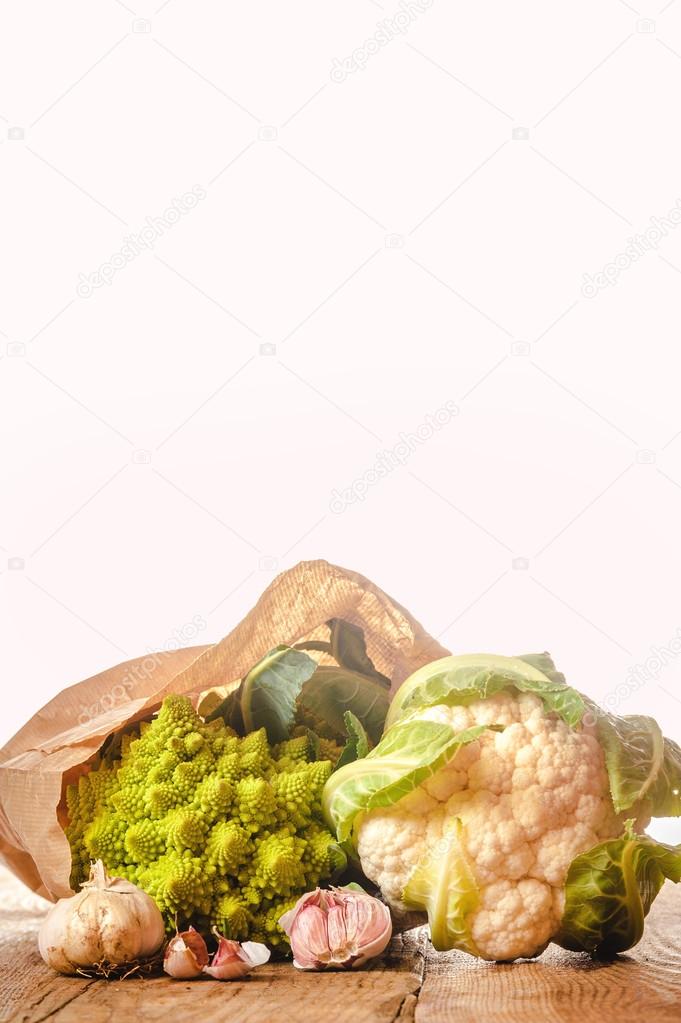 Romanesco broccoli with cauliflower and garlic in a paper bag on