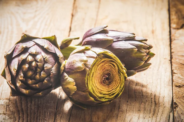 Fresh vegetables, artichoke on a wooden rustic background — Stock Photo, Image