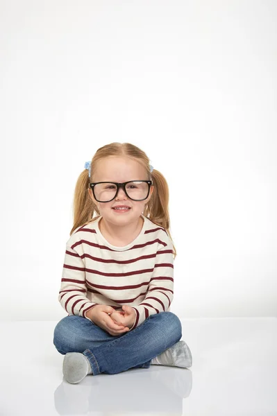 Cute little girl with glasses on a white background — Stock Photo, Image