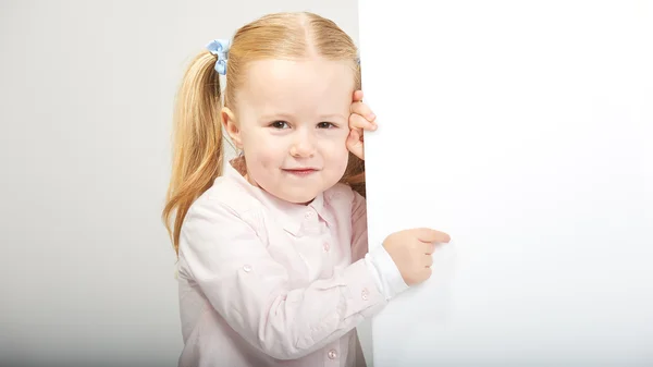 Beautiful little girl with white copy space on a white backgroun — Stock Photo, Image