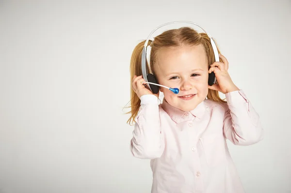 Young cheerful female customer support operator with headset and — Stock Photo, Image