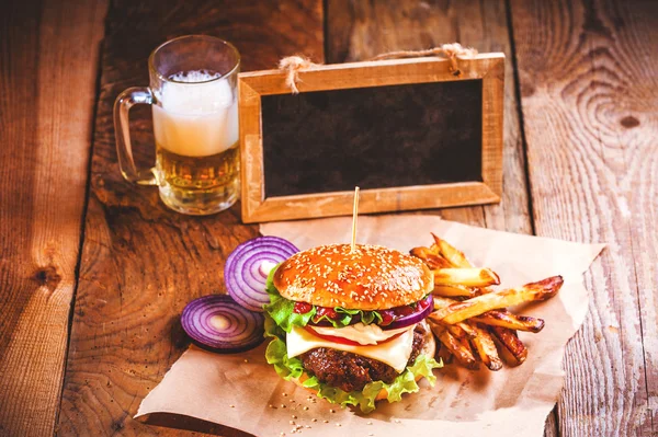Juicy and fragrant hamburger with fries homemade copy space for — Stock Photo, Image