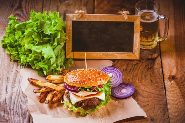 Juicy and fragrant hamburger with fries homemade copy space for — Stock Photo, Image