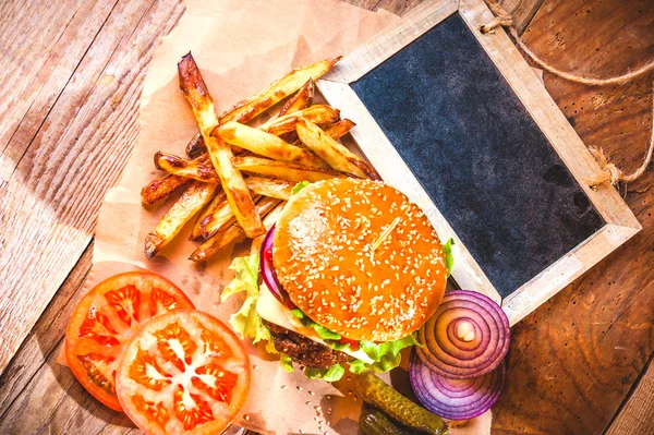 Juicy and fragrant hamburger with fries homemade copy space for — Stock Photo, Image