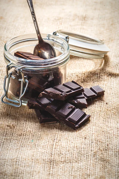 Pieces of dark chocolate in a jar Vintage — Stock Photo, Image