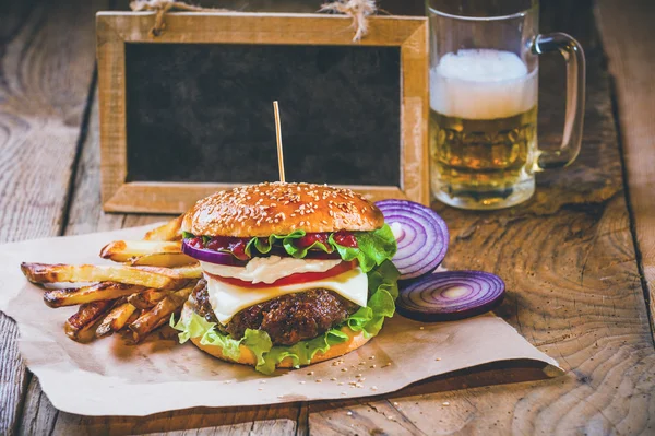 Juicy and fragrant hamburger with fries homemade copy space for — Stock Photo, Image