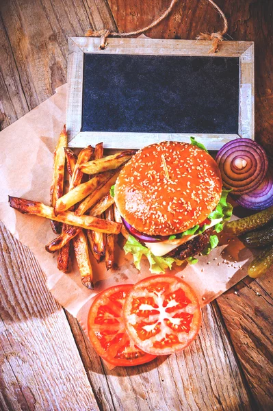 Juicy and fragrant hamburger with fries homemade copy space for — Stock Photo, Image