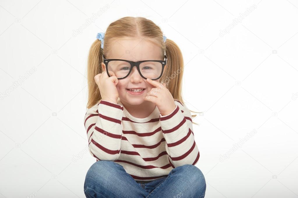 Cute little girl with glasses on a white background