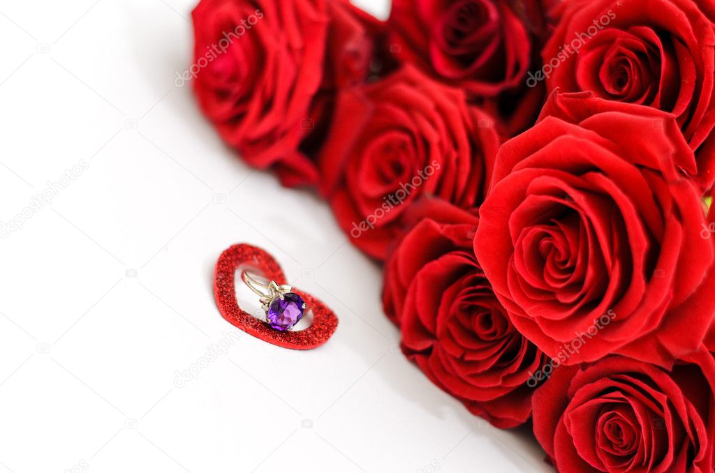 Red roses and a ring in a heart