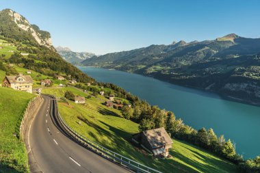 Road in alpine landscape overlooking Lake Walensee near Amden, Canton of St. Gallen, Switzerland 