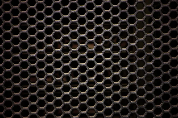 Hexagonal, honey comb stainless steel mesh on black — Stock Photo, Image
