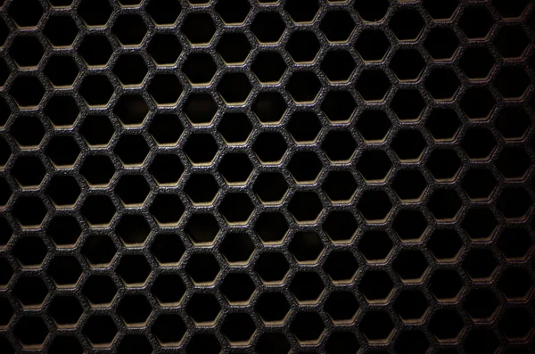 Hexagonal, honey comb stainless steel mesh on black — Stock Photo, Image