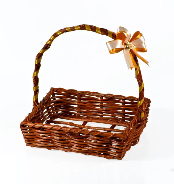 Empty wicker basket with bow isolated on white background — Stock Photo, Image