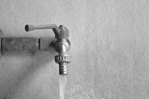 Faucet on concrete  wall — Stock Photo, Image