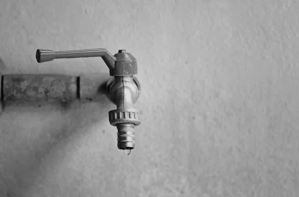 Faucet on concrete  wall — Stock Photo, Image