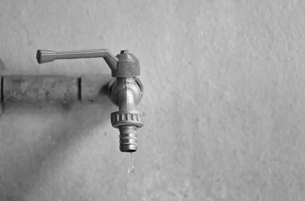 Faucet on concrete  wall — Stock Photo, Image