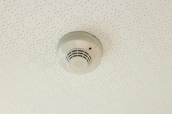 Smoke detector on a ceiling — Stock Photo, Image