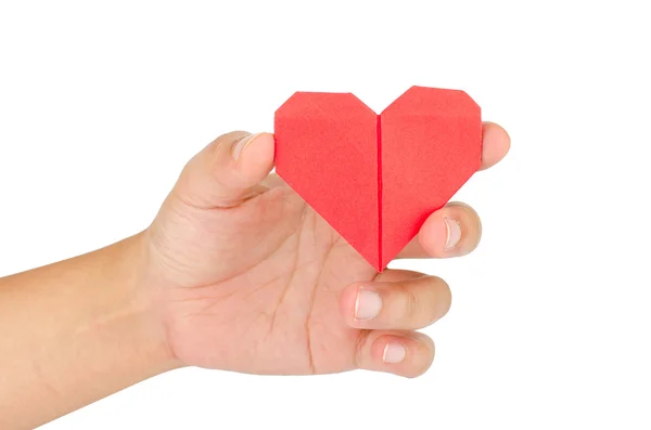 Mano femenina sosteniendo el corazón de papel — Foto de Stock