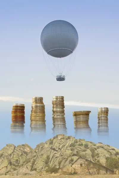 Globo de gas, estacas de monedas y rocas —  Fotos de Stock