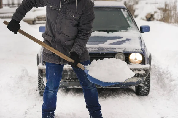 Guy Holding Shovel His Hands Snow Car Clearing Road Car — стоковое фото
