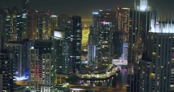 Uraban City Skyline Cars and Skyscrapers Night Lights Flicker Downtown Financial District Marina Dubai Red Epic 8K — Stockvideo