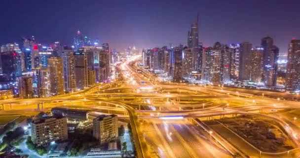 Aerial Of Urban Highway At Night Cars Lights Moving Junction Overpass City Panorama Dubai Business District Low Light Uhd Hdr 4k — Stock Video